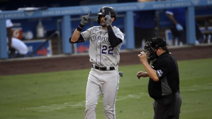 LOS ANGELES, CA - AUGUST 22: Sam Hilliard #22 of the Colorado Rockies celebrates his one-run home run against pitcher Dustin May #85 of the Los Angeles Dodgers during the third inning at Dodger Stadium on August 22, 2020 in Los Angeles, California. (Photo by Kevork Djansezian/Getty Images)