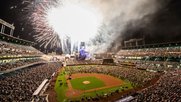 DENVER, CO - SEPTEMBER 20: The grand finale of a fireworks show are set over the field as spectators fill the outfield after a game between the Colorado Rockies and the Arizona Diamondbacks at Coors Field on September 20, 2013 in Denver, Colorado. The Rockies beat the Diamondbacks 9-4. (Photo by Dustin Bradford/Getty Images)