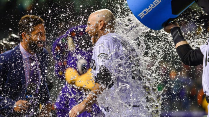 DENVER, CO - MAY 28: Chris Iannetta #22 of the Colorado Rockies receives an ice bath from Charlie Blackmon #19 of the Colorado Rockies after hitting a 10th inning walk-off single against the San Francisco Giants at Coors Field on May 28, 2018 in Denver, Colorado. (Photo by Dustin Bradford/Getty Images)