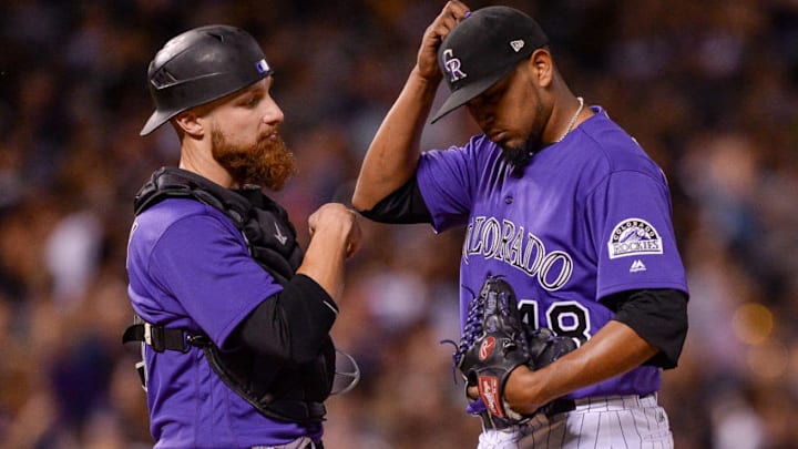 DENVER, CO - AUGUST 18: Jonathan Lucroy #21 and German Marquez #48 of the Colorado Rockies have a word on the mound as Marquez is relieved after making two outs in the sixth inning against the Milwaukee Brewers at Coors Field on August 18, 2017 in Denver, Colorado. (Photo by Dustin Bradford/Getty Images)