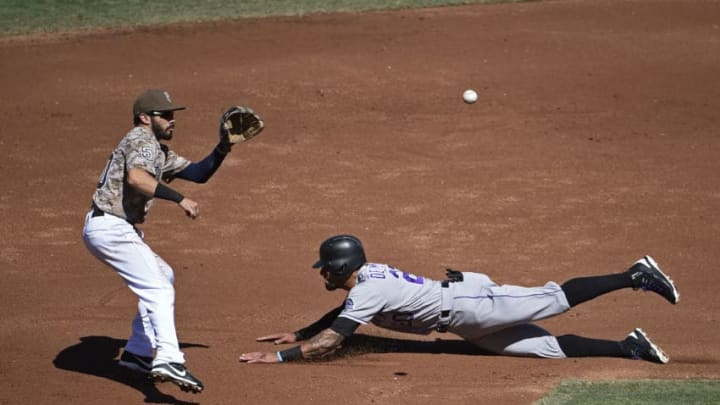 SAN DIEGO, CA - SEPTEMBER 24: Ian Desmond #20 of the Colorado Rockies steals second base ahead of the throw to Carlos Asuaje #20 of the San Diego Padres during the second inning of a baseball game at PETCO Park on September 24, 2017 in San Diego, California. (Photo by Denis Poroy/Getty Images)
