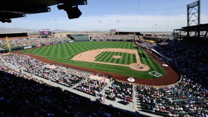 SCOTTSDALE, AZ - MARCH 14: Fans follow the action on the baseball diamond between the Cincinnati Reds and the Colorodo Rockis during the spring training baseball game at Salt River Fields at Talking Stick on March 14, 2011 in Scottsdale, Arizona. (Photo by Kevork Djansezian/Getty Images)