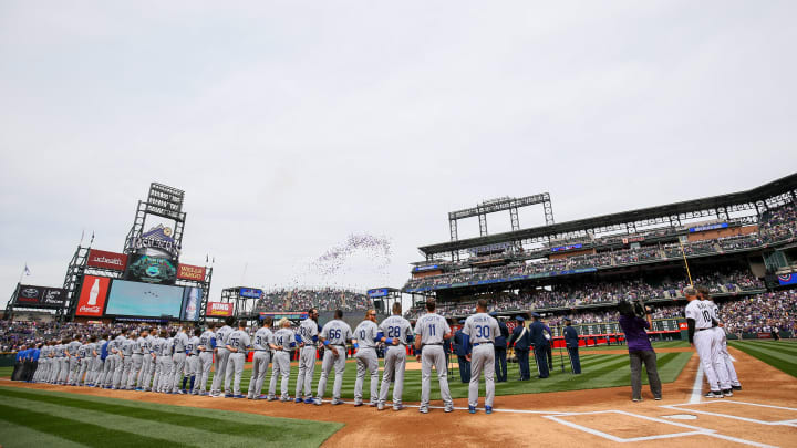 DENVER, CO – APRIL 7: The Los Angeles Dodgers and Colorado Rockies stand on the field before the opening day game at Coors Field on April 7, 2017 in Denver, Colorado. (Photo by Justin Edmonds/Getty Images)