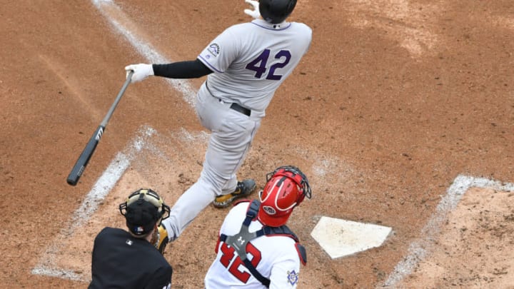 WASHINGTON, DC - APRIL 15: DJ LeMahieu #42 of the Colorado Rockies hits a home run in the eighth inning during a baseball game against the Washington Nationals at Nationals Park on April 15, 2018 in Washington, DC. All players are wearing #42 in honor of Jackie Robinson Day. (Photo by Mitchell Layton/Getty Images)