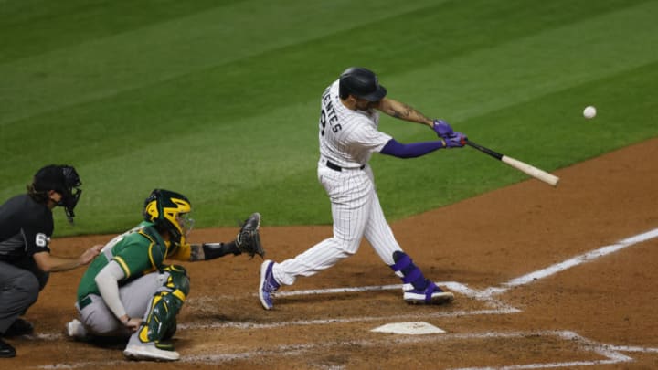 DENVER, CO - SEPTEMBER 15: Josh Fuentes #8 of the Colorado Rockies hits an RBI sacrifice fly during the sixth inning against the Oakland Athletics at Coors Field on September 15, 2020 in Denver, Colorado. (Photo by Justin Edmonds/Getty Images)