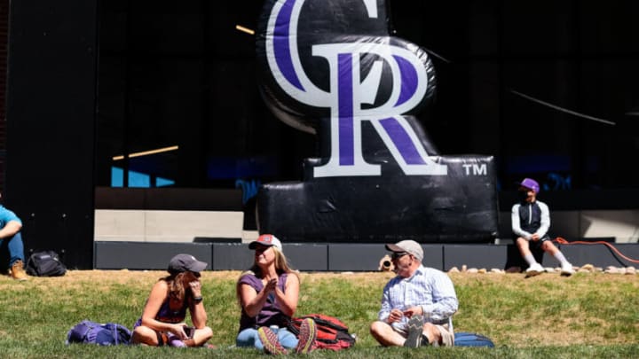 Apr 1, 2021; Denver, Colorado, USA; Fans relax in the grass at McGregor Square before the Opening Day game between the Colorado Rockies and the Los Angeles Dodgers at Coors Field. Mandatory Credit: Isaiah J. Downing-USA TODAY Sports