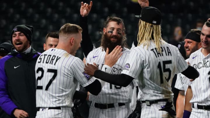 May 4, 2021; Denver, Colorado, USA; Colorado Rockies right fielder Charlie Blackmon (19) celebrates his three-run home run with shortstop Trevor Story (27) and left fielder Raimel Tapia (15) to defeat San Francisco Giants the ninth inning at Coors Field. Mandatory Credit: Ron Chenoy-USA TODAY Sports