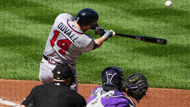Sep 5, 2021; Denver, Colorado, USA; Atlanta Braves left fielder Adam Duvall (14) hits a three run home run in the third inning against the Colorado Rockies at Coors Field. Mandatory Credit: Ron Chenoy-USA TODAY Sports