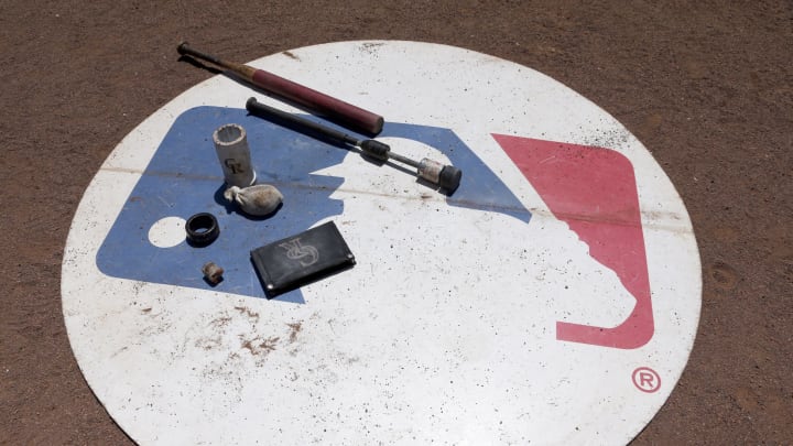 Aug 11, 2016; Arlington, TX, USA; A general view of the MLB logo with Colorado Rockies batting gear on it during the game against the Texas Rangers at Globe Life Park in Arlington. Colorado Rockies won 12-9. Mandatory Credit: Tim Heitman-USA TODAY Sports