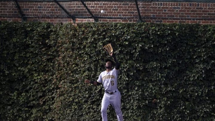 Aug 29, 2016; Chicago, IL, USA; Pittsburgh Pirates left fielder Starling Marte (6) makes a catch in the warning track during the first inning against the Chicago Cubs at Wrigley Field. Mandatory Credit: Caylor Arnold-USA TODAY Sports