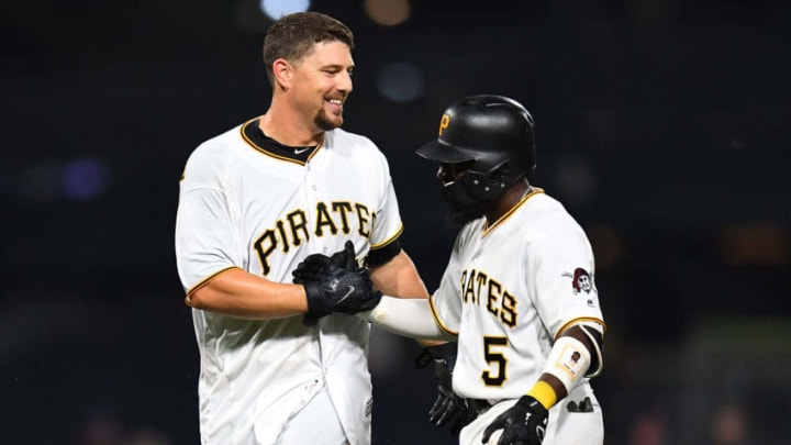 PITTSBURGH, PA - SEPTEMBER 18: Ryan Lavarnway #63 of the Pittsburgh Pirates celebrates his game-winning RBI single with Josh Harrison #5 during the 11th inning against the Kansas City Royals at PNC Park on September 18, 2018 in Pittsburgh, Pennsylvania. (Photo by Joe Sargent/Getty Images)