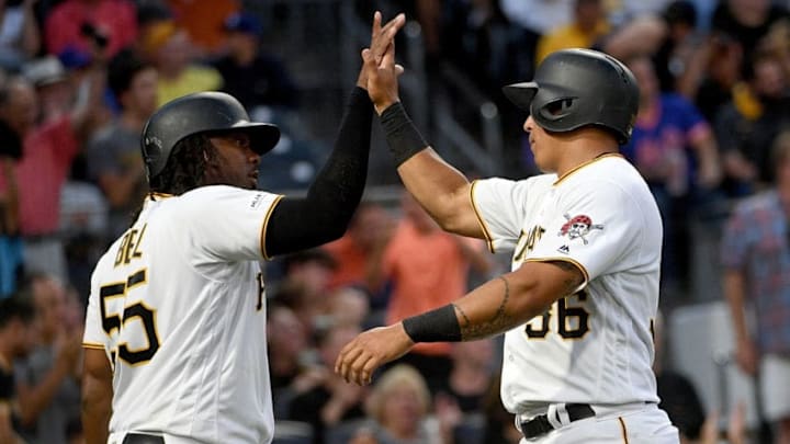 PITTSBURGH, PA - AUGUST 02: Jose Osuna #36 of the Pittsburgh Pirates celebrates with Josh Bell #55 after coming around to score on an two run RBI double by Melky Cabrera #53 in the fourth inning during the game against the New York Mets at PNC Park on August 2, 2019 in Pittsburgh, Pennsylvania. (Photo by Justin Berl/Getty Images)
