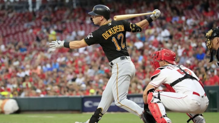 CINCINNATI, OHIO - JULY 30: Corey Dickerson #12 of the Pittsburgh Pirates hits a two RBI single in the third inning against the Cincinnati Reds at Great American Ball Park on July 30, 2019 in Cincinnati, Ohio. (Photo by Andy Lyons/Getty Images)