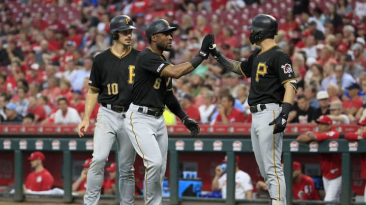 CINCINNATI, OHIO - JULY 30: Starling Marte #6 of the Pittsburgh Pirates is congratulated by Kevin Newman #27 after scoring in the third inning against the Cincinnati Reds at Great American Ball Park on July 30, 2019 in Cincinnati, Ohio. (Photo by Andy Lyons/Getty Images)