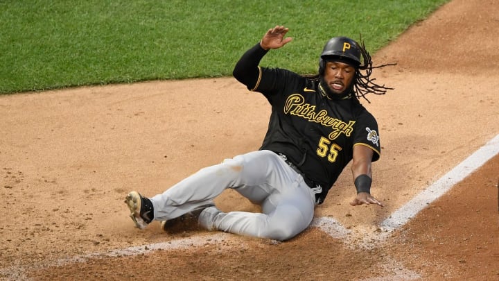 MINNEAPOLIS, MINNESOTA – AUGUST 03: Josh Bell #55 of the Pittsburgh Pirates slides safely into home plate to score a run against the Minnesota Twins during the fifth inning of the game at Target Field on August 3, 2020 in Minneapolis, Minnesota. (Photo by Hannah Foslien/Getty Images)