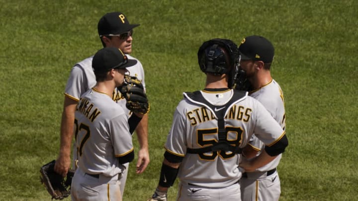 CHICAGO, ILLINOIS - AUGUST 02: Right, Chad Kuhl #39 of the Pittsburgh Pirates speaks with teammates on the mound during the fifth inning of a game against the Chicago Cubs at Wrigley Field on August 02, 2020 in Chicago, Illinois. (Photo by Nuccio DiNuzzo/Getty Images)