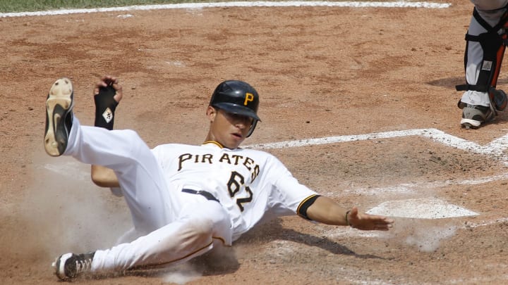 PITTSBURGH, PA – JULY 8: Gorkys Hernandez #62 of the Pittsburgh Pirates scores in the sixth inning on a throw error by the San Francisco Giants during the game on July 8, 2012 at PNC Park in Pittsburgh, Pennsylvania. The Pirates defeated the Giants 13-2. (Photo by Justin K. Aller/Getty Images)