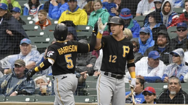 CHICAGO, IL - JUNE 10: Josh Harrison #5 of the Pittsburgh Pirates is greeted by Corey Dickerson #12 after hitting a home run against the Chicago Cubs during the first inning on June 10, 2018 at Wrigley Field in Chicago, Illinois. (Photo by David Banks/Getty Images)