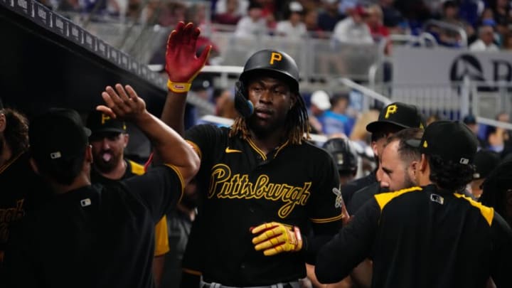 Jul 12, 2022; Miami, Florida, USA; Pittsburgh Pirates shortstop Oneil Cruz (15) celebrates in the dugout after scoring a run in the fifth inning against the Miami Marlins at loanDepot park. Mandatory Credit: Jasen Vinlove-USA TODAY Sports