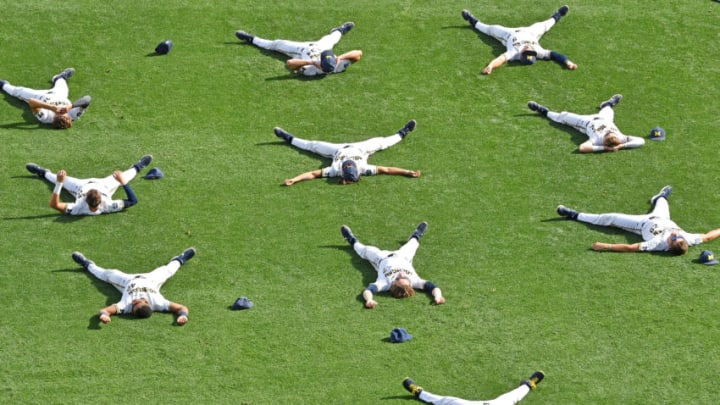 OMAHA, NE - JUNE 25: Players of the Michigan Wolverines stretch on the field, prior to game two of the College World Series Championship Series against the Vanderbilt Commodores on June 25, 2019 at TD Ameritrade Park Omaha in Omaha, Nebraska. (Photo by Peter Aiken/Getty Images)