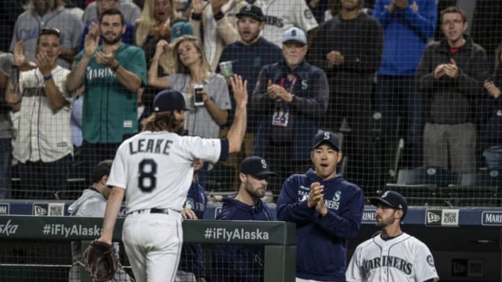 SEATTLE, WA - JULY 3: Starting pitcher Mike Leake #8 of the Seattle Mariners acknowledges fans and teammates including Yusei Kikuchi #18 of the Seattle Mariners (2R) after coming off the fiel during the eighth inning of a game against the St. Louis Cardinals at T-Mobile Park on July 3, 2019 in Seattle, Washington. The Cardinals won the game 5-2. (Photo by Stephen Brashear/Getty Images)