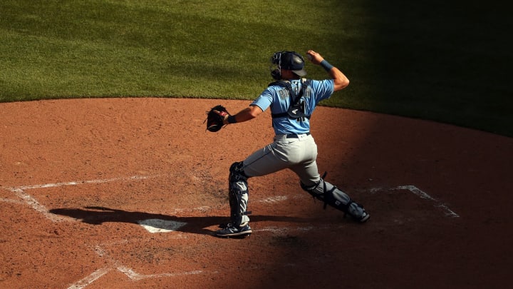 Cal Raleigh of the Seattle Mariners throws to second base.