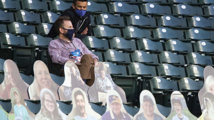 Seattle Mariners general manager Jerry Dipoto sits in the stands.