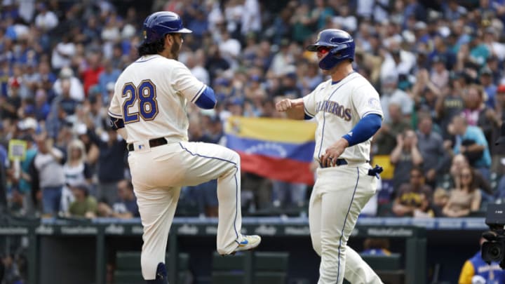 SEATTLE, WASHINGTON - SEPTEMBER 14: Ty France #23 celebrates a home run by Eugenio Suarez #28 of the Seattle Mariners during the first inning against the San Diego Padres at T-Mobile Park on September 14, 2022 in Seattle, Washington. (Photo by Steph Chambers/Getty Images)