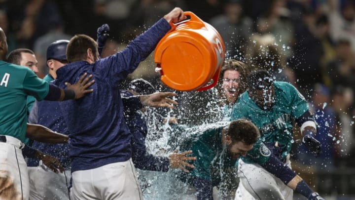 SEATTLE, WA - JUNE 1: Mitch Haniger #17 of the Seattle Mariners is doused by Gatorade after hitting a walkoff solo home run off of relief pitcherMatt Andriese #35 of the Tampa Bay Rays during the thirteenth inning of a game at Safeco Field on June 1, 2018 in Seattle, Washington. The Mariners won 4-3 in thirteen innings. (Photo by Stephen Brashear/Getty Images)
