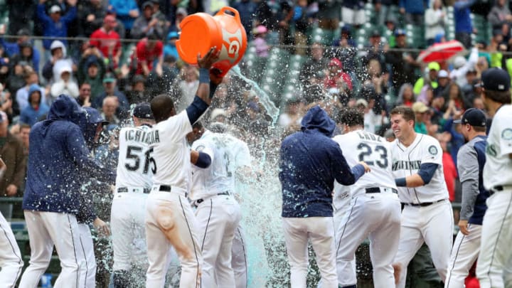 SEATTLE, WA - JUNE 13: The Seattle Mariners celebrate after the game winning two run home run by Mitch Haniger #17 of the Seattle Mariners in the ninth inning against the Los Angeles Angels during their game at Safeco Field on June 13, 2018 in Seattle, Washington. (Photo by Abbie Parr/Getty Images)