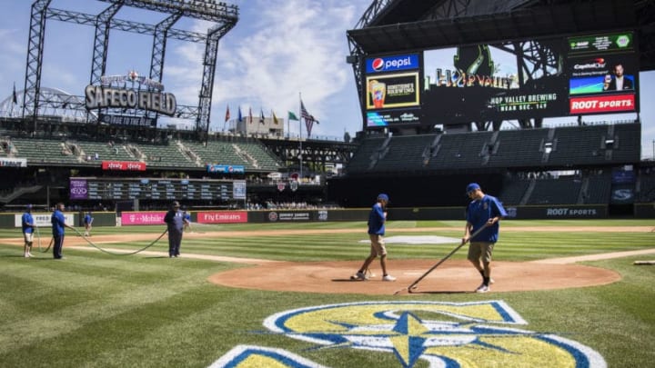 SEATTLE, WA - JULY 09: The Seattle grounds crew prepares the field before the game between the Seattle Mariners and the Oakland Athletics at Safeco Field on July 9, 2017 in Seattle, Washington. (Photo by Lindsey Wasson/Getty Images)