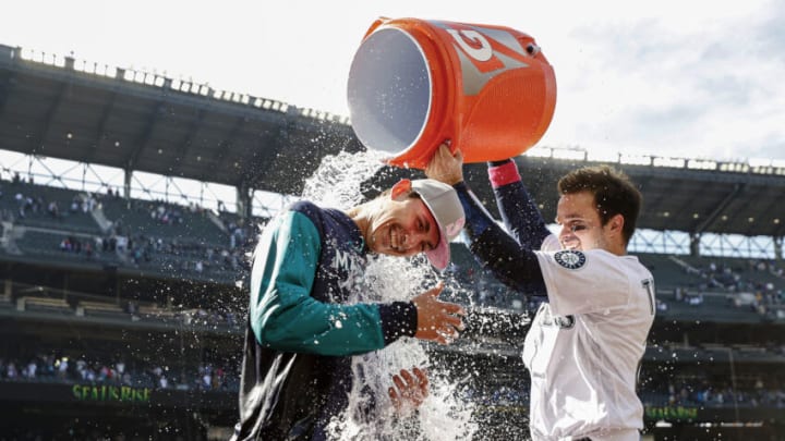SEATTLE, WASHINGTON - MAY 08: Luis Torrens #22 douses George Kirby #68 of the Seattle Mariners with water after beating the Tampa Bay Rays 2-1 during the tenth inning at T-Mobile Park on May 08, 2022 in Seattle, Washington. (Photo by Steph Chambers/Getty Images)