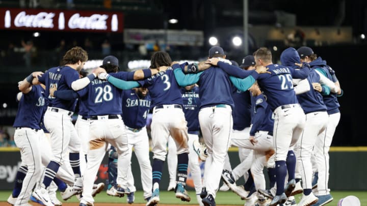 SEATTLE, WASHINGTON - SEPTEMBER 29: The Seattle Mariners celebrate after beating Texas Rangers 10-9 during the eleventh inning at T-Mobile Park on September 29, 2022 in Seattle, Washington. (Photo by Steph Chambers/Getty Images)