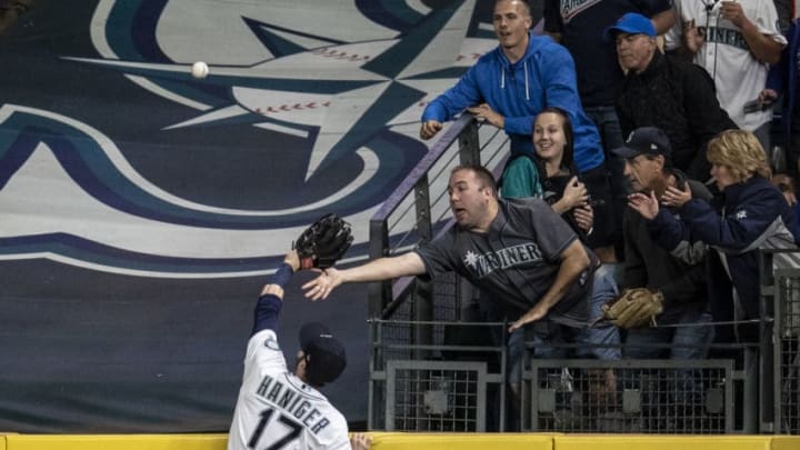 SEATTLE, WA - AUGUST 2: Leftfielder Mitch Haniger #17 of the Seattle Mariners climbs the wall in an effor to get to a two-run home run hit by Kendrys Morales #8 of the Toronto Blue Jays off ofg Juan Nicasio #12 of the Seattle Mariners that also scored Randal Grichuk #15 of the Toronto Blue Jays during the seventh inning of game at Safeco Field on August 2, 2018 in Seattle, Washington. (Photo by Stephen Brashear/Getty Images)