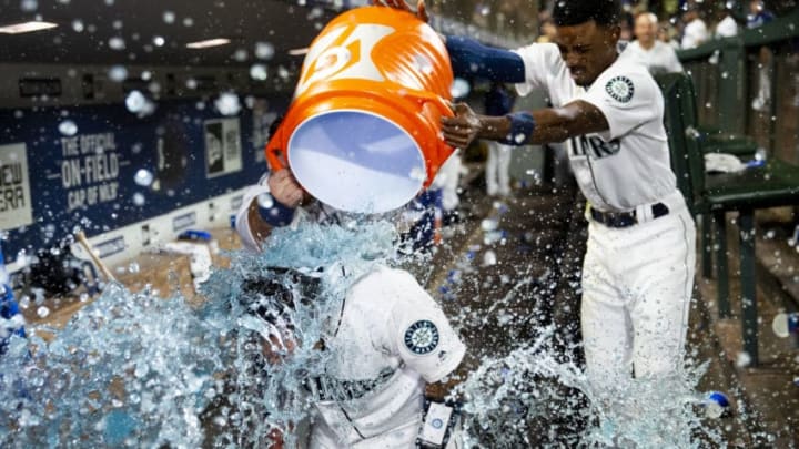SEATTLE, WA - SEPTEMBER 14: Dee Gordon #9 of the Seattle Mariners helps pour Gatorade over Omar Narvaez #22 after he hit a walk-off home run against the Chicago White Sox at T-Mobile Park on September 14, 2019 in Seattle, Washington. The Seattle Mariners beat the Chicago White Sox 2-1. (Photo by Lindsey Wasson/Getty Images)