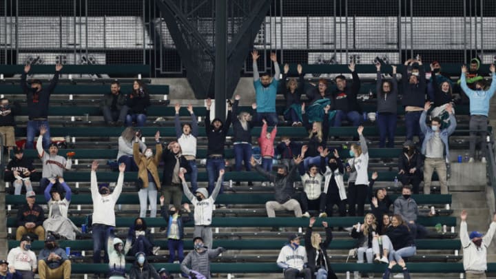 SEATTLE, WASHINGTON - APRIL 03: Fans do the wave during the game between the Seattle Mariners and the San Francisco Giants at T-Mobile Park on April 03, 2021 in Seattle, Washington. (Photo by Steph Chambers/Getty Images)