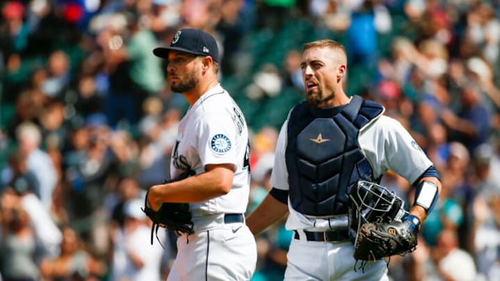 Jul 8, 2021; Seattle, Washington, USA; Seattle Mariners relief pitcher Kendall Graveman (left) and catcher Tom Murphy (right) react after defeating the New York Yankees. Mandatory Credit: Joe Nicholson-USA TODAY Sports Jul 8, 2021; Seattle, Washington, USA; Seattle Mariners relief pitcher Kendall Graveman (left) and catcher Tom Murphy (right) react after defeating the New York Yankees. Mandatory Credit: Joe Nicholson-USA TODAY Sports