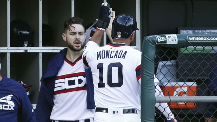 CHICAGO, ILLINOIS - JULY 06: Lucas Giolito #27 of the Chicago White Sox congratulates Yoan Moncada #10 after he scored during the third inning against the Chicago Cubsat Guaranteed Rate Field on July 06, 2019 in Chicago, Illinois. (Photo by Nuccio DiNuzzo/Getty Images)