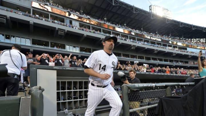 CHICAGO, IL - SEPTEMBER 27: Paul Konerko #14 of the Chicago White Sox runs onto the field as he is introduced for a pre game honoring his career before the game against the Kansas City Royals at U.S. Cellular Field on September 27, 2014 in Chicago, Illinois. The White Sox captain is set to retire at the end of the season. (Photo by Brian Kersey/Getty Images)