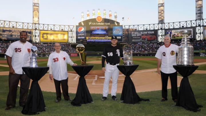 CHICAGO - AUGUST 27: (L-R) NFL Hall of Fame player Richard Dent #95, Chicago Bulls Chairman Jerry Reinsdorf, Chicago White Sox pitcher Mark Buehrle #56 and Chicago Blackhawks head coach Joel Quennvile pose with their respective championship trophies prior to the game between the Chicago White Sox and New York Yankees on August 27, 2010 at U.S. Cellular Field in Chicago, Illinois. Chicago is the only city to win all four major titles in the last 25 years. The White Sox defeated the Yankees 9-4. (Photo by Ron Vesely/MLB Photos via Getty Images)