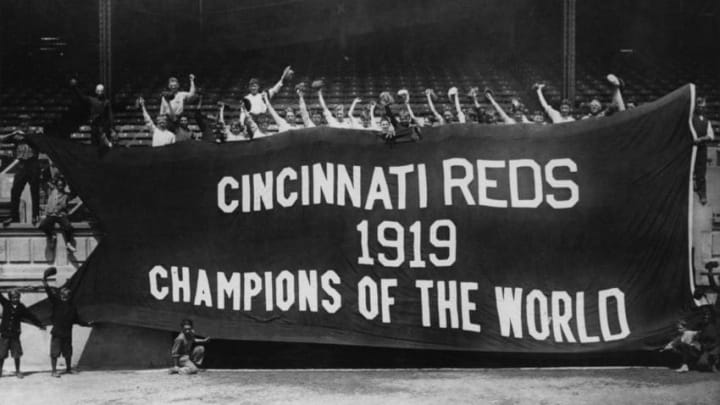 The victorious Cincinnati Reds hold up a banner after beating the Chicago White Sox in 1919's infamous World Series. (Photo by FPG/Getty Images)