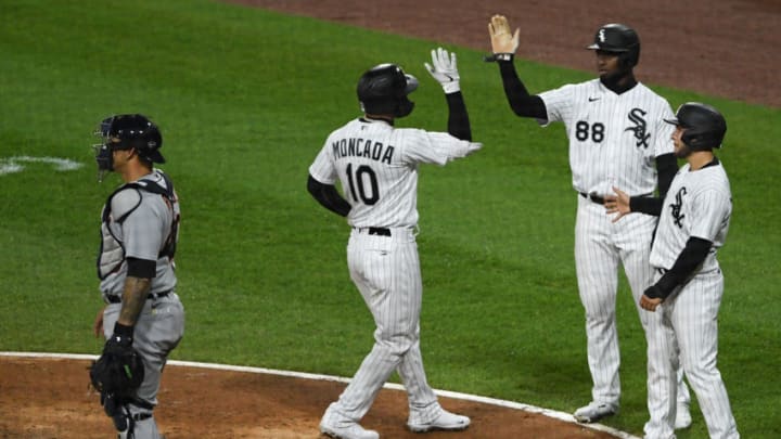 CHICAGO, ILLINOIS - APRIL 29: Yoan Moncada #10, Nick Madrigal #1, and Luis Robert #88 of the Chicago White Sox celebrate the home run in the fifth inning in front of Wilson Ramos #40 of the Detroit Tigers at Guaranteed Rate Field on April 29, 2021 in Chicago, Illinois. (Photo by Quinn Harris/Getty Images)