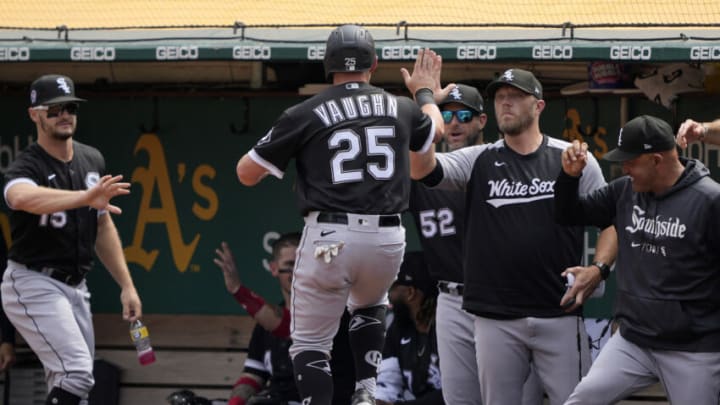 OAKLAND, CALIFORNIA - SEPTEMBER 11: Andrew Vaughn #25 of the Chicago White Sox is congratulated by teammates after he scored against the Oakland Athletics in the top of the first inning at RingCentral Coliseum on September 11, 2022 in Oakland, California. (Photo by Thearon W. Henderson/Getty Images)