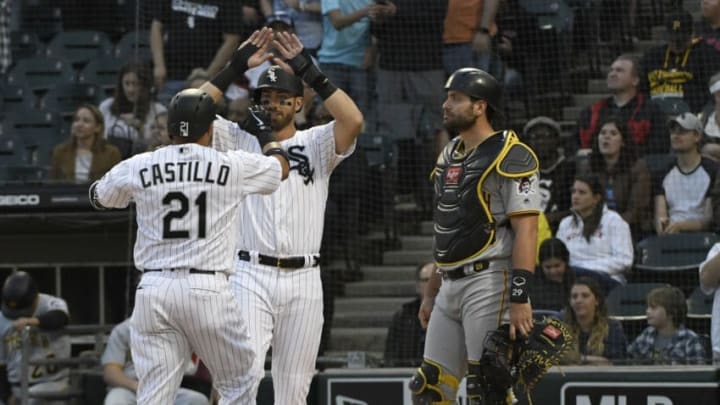 CHICAGO, IL - MAY 08: Welington Castillo #21 of the Chicago White Sox is greeted by Nicky Delmonico #30 after hitting a two-run homer as Francisco Cervelli #29 of the Pittsburgh Pirates stands nearby during the first inning on May 8, 2018 at Guaranteed Rate Field in Chicago, Illinois. (Photo by David Banks/Getty Images)