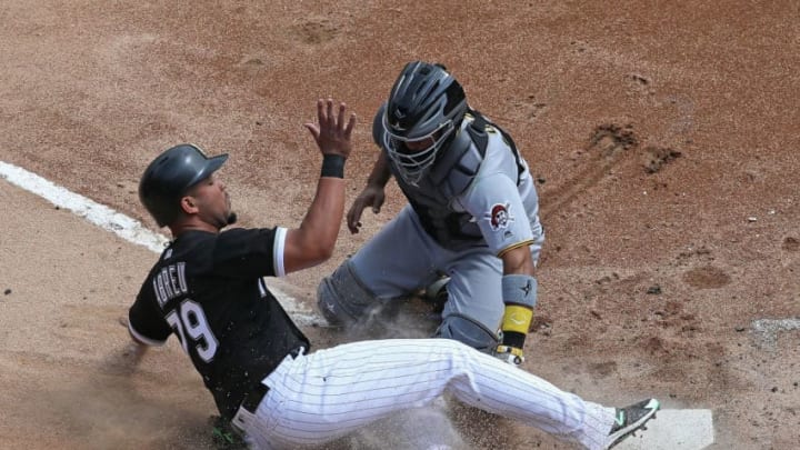 CHICAGO, IL - MAY 09: Jose Abreu #79 of the Chicago White Sox is tagged out at the plate by Elias Diaz #32 of the Pittsburgh Pirates to end the third inning at Guaranteed Rate Field on May 9, 2018 in Chicago, Illinois. (Photo by Jonathan Daniel/Getty Images)