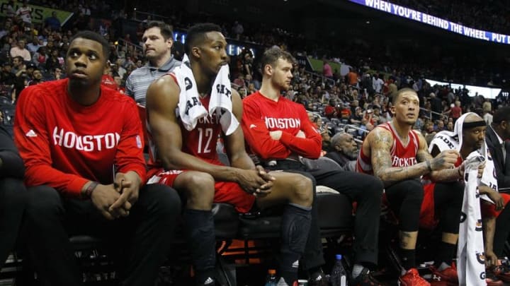 Mar 19, 2016; Atlanta, GA, USA; Houston Rockets forward Terrence Jones (6) and center Dwight Howard (12) and forward Donatas Motiejunas (20) and forward Michael Beasley (8) and guard Jason Terry (31) react on the bench against the Atlanta Hawks in the fourth quarter at Philips Arena. The Hawks defeated the Rockets 109-97. Mandatory Credit: Brett Davis-USA TODAY Sports