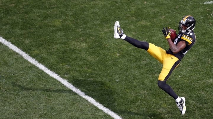 Sep 28, 2014; Pittsburgh, PA, USA; Pittsburgh Steelers cornerback Cortez Allen (28) intercepts the ball against the Tampa Bay Buccaneers during the third quarter at Heinz Field. The Buccaneers won 27-24. Mandatory Credit: Charles LeClaire-USA TODAY Sports