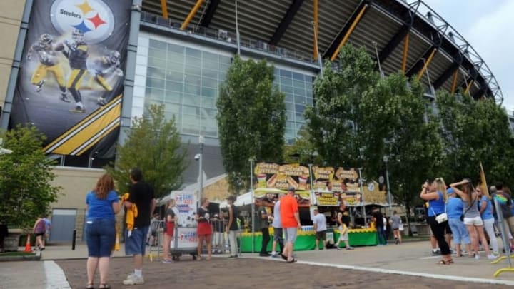 Aug 12, 2016; Pittsburgh, PA, USA; Pittsburgh Steelers fans walk outside of Heinz Field before the game between the Pittsburgh Steelers and the Detroit Lions. Mandatory Credit: Jason Bridge-USA TODAY Sports