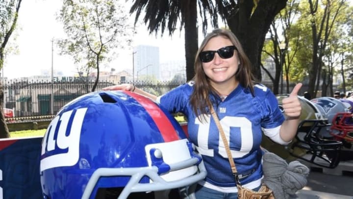 Nov 21, 2016; Mexico City, MEX; Female fan poses with replica New York Giants helmet during the NFL Fan Fest at Chapultepec Park prior to the NFL International Series game between the Houston Texans and the Oakland Raiders. Mandatory Credit: Kirby Lee-USA TODAY Sports