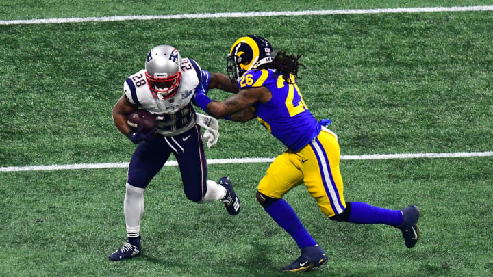 ATLANTA, GEORGIA – FEBRUARY 03: Mark Barron #26 of the Los Angeles Rams attempts to tackle James White #28 of the New England Patriots in the second half during Super Bowl LIII at Mercedes-Benz Stadium on February 03, 2019 in Atlanta, Georgia. (Photo by Scott Cunningham/Getty Images)